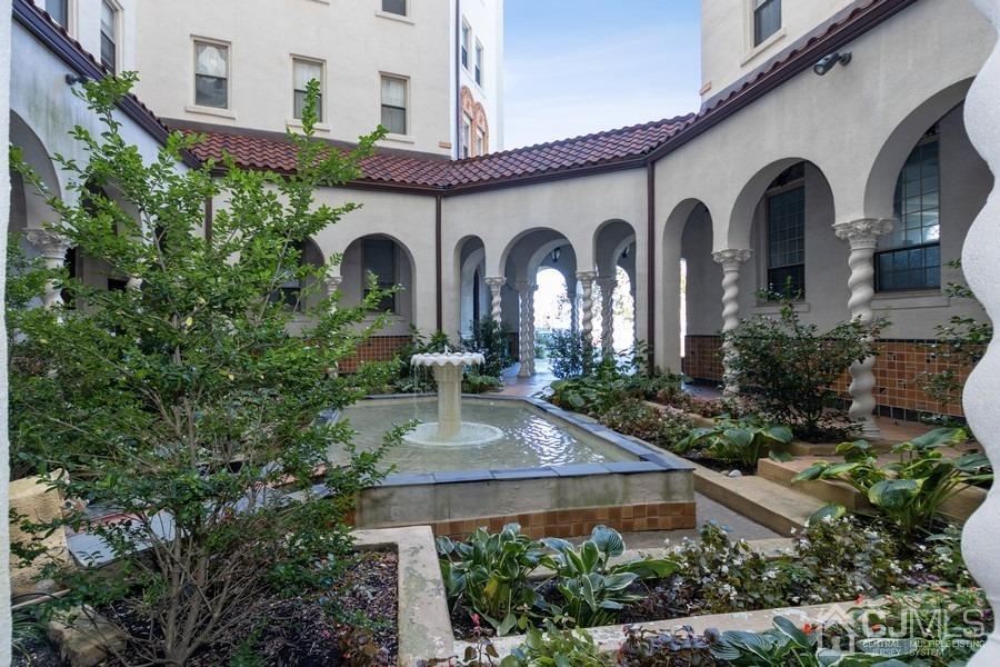 400 Deal Lake Drive, Unit 4G Asbury Park, NJ 07712 - Photo 5 of 20 a front view of a house with garden