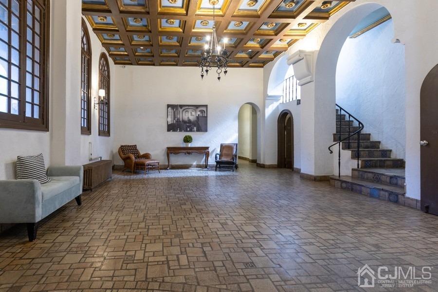 400 Deal Lake Drive, Unit 4G Asbury Park, NJ 07712 - Photo 7 of 20 a view of a livingroom with furniture and a hallway
