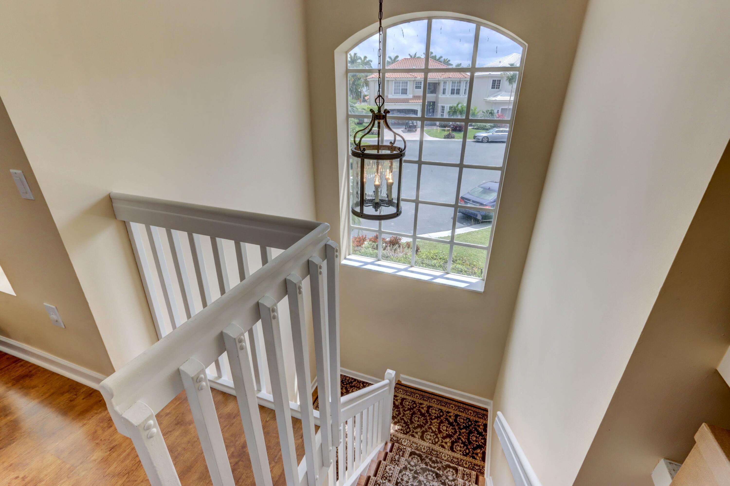 4075 Northwest 58th Lane Boca Raton, FL 33496 - Photo 14 of 24 Staircase & Perspective Onto Cul-de-Sac