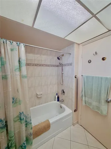a spacious bathroom with a double vanity sink toilet and shower
