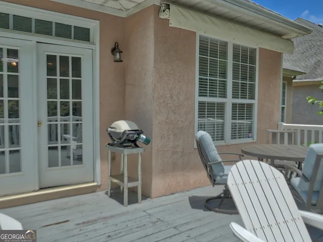 a view of a deck with chair and table