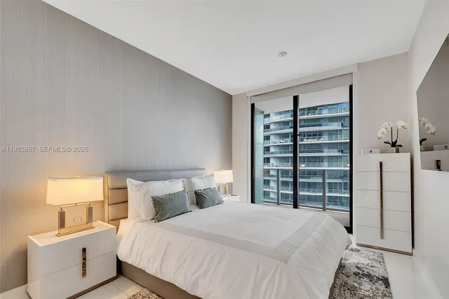 a bedroom with a bed and a cabinets