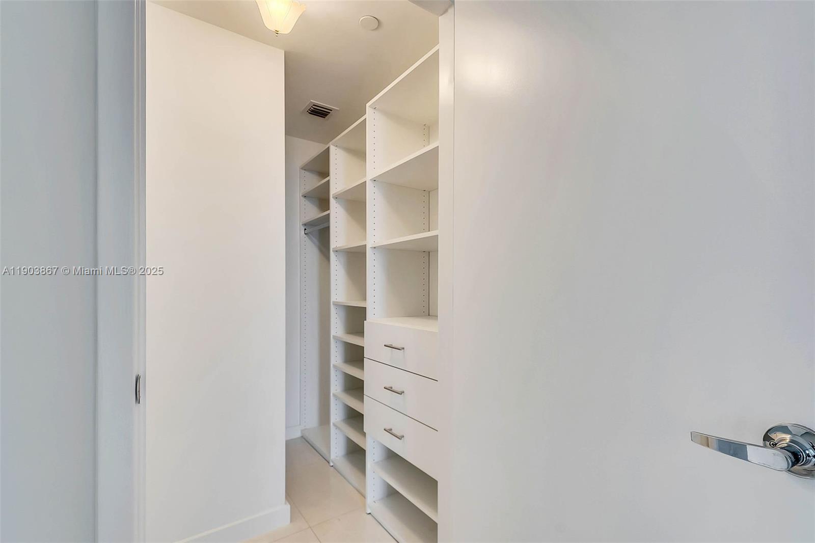 1010 Brickell Avenue, Unit 4309 Miami, FL 33131 - Photo 19 of 30 a view of walk in closet with empty racks
