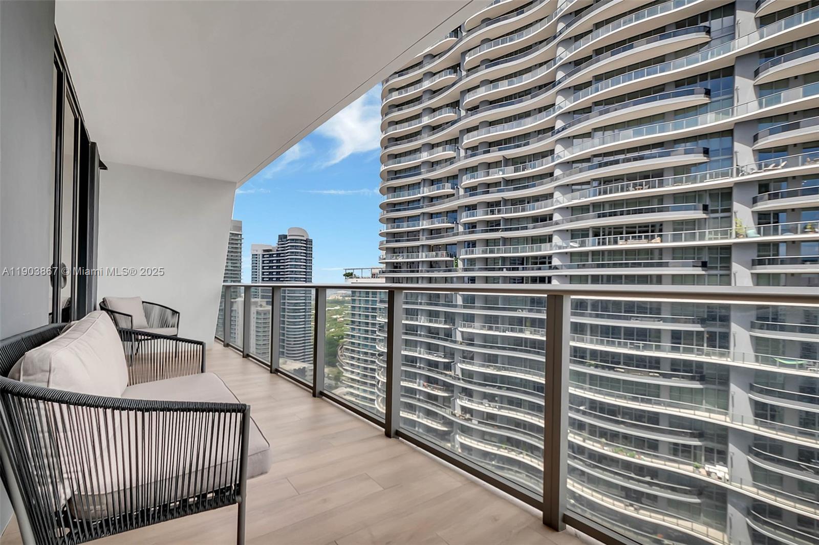 1010 Brickell Avenue, Unit 4309 Miami, FL 33131 - Photo 21 of 30 a view of a balcony and floor to ceiling window
