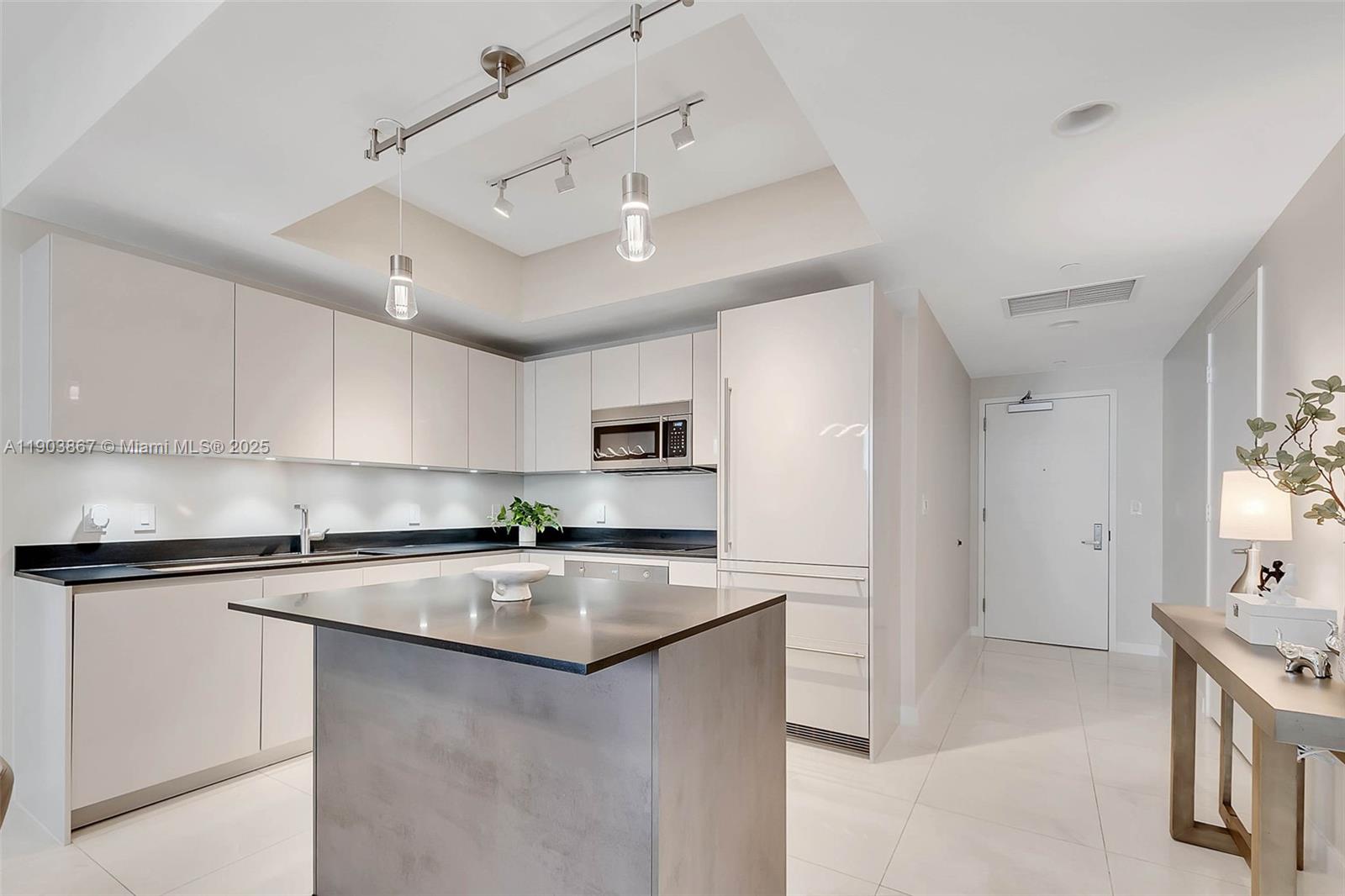 1010 Brickell Avenue, Unit 4309 Miami, FL 33131 - Photo 8 of 30 a kitchen with stainless steel appliances granite countertop a sink stove and refrigerator