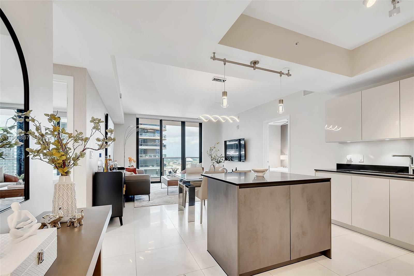 1010 Brickell Avenue, Unit 4309 Miami, FL 33131 - Photo 9 of 30 a living room with stainless steel appliances kitchen island granite countertop furniture and a kitchen view