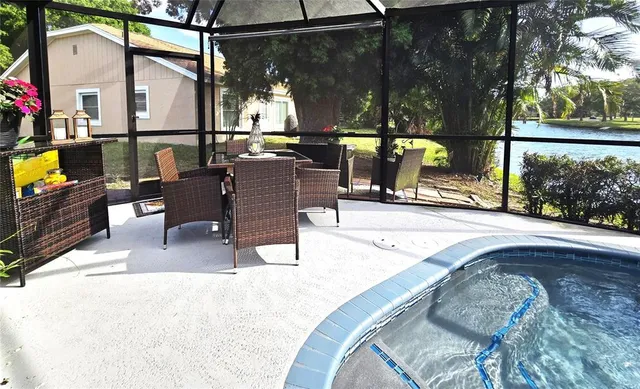 swimming pool view with a outdoor seating space
