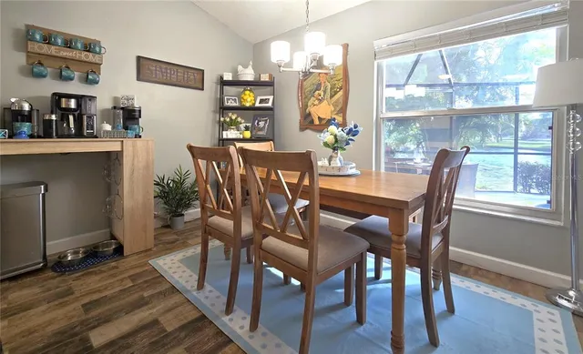 a dining room with furniture and window