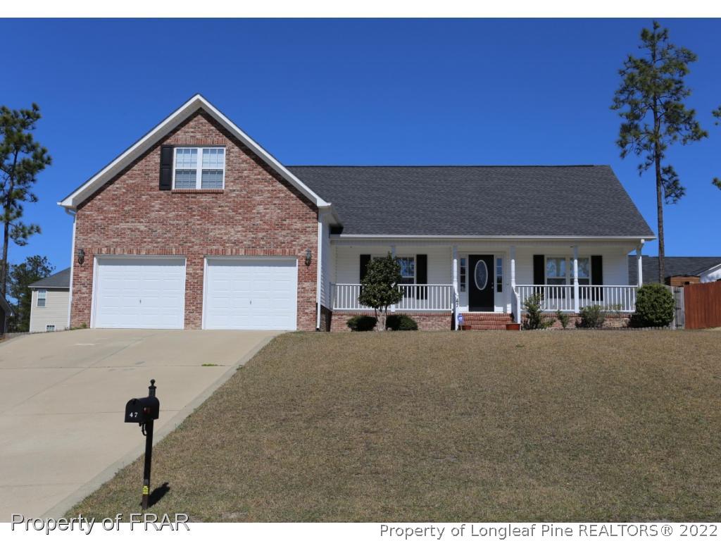 47 Rockingham Street Spring Lake, NC 28390 - Photo 1 of 27 a front view of house with yard and outdoor seating