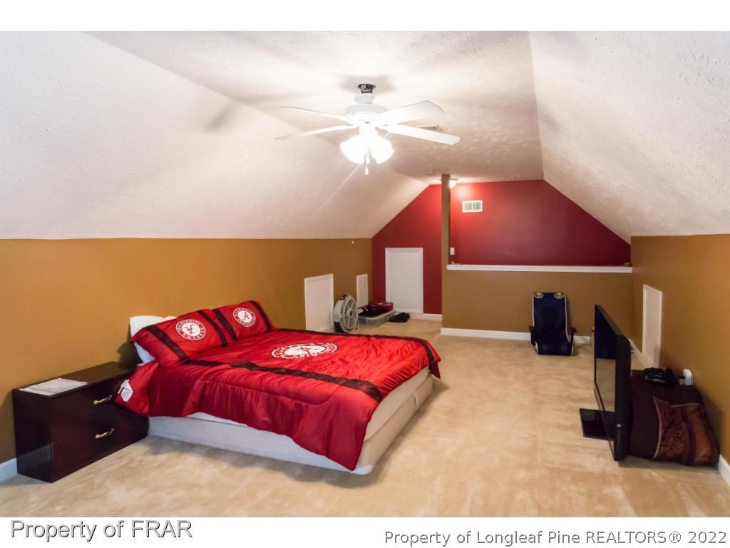 47 Rockingham Street Spring Lake, NC 28390 - Photo 25 of 27 a bed room with a bed and a television