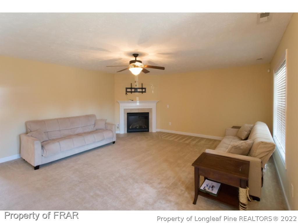 47 Rockingham Street Spring Lake, NC 28390 - Photo 3 of 27 a living room with furniture and a chandelier