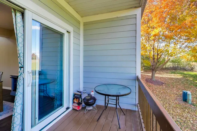 a view of balcony with furniture