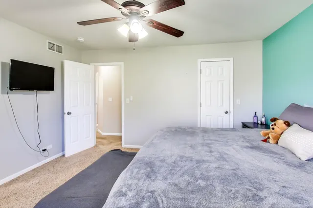 a view of a livingroom with furniture and a flat screen tv