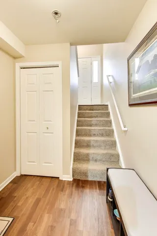 a view of an entryway with wooden floor