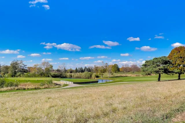 a view of a golf course with a lake