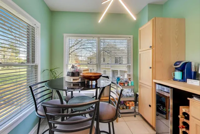 a view of a dining room with furniture window and outside view