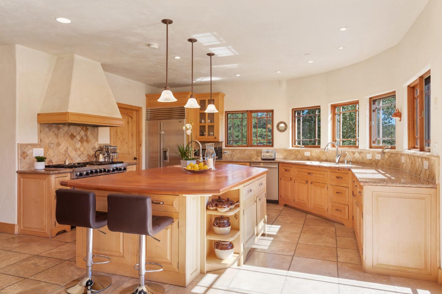 175 Chaparral Road Carmel Valley, CA 93924 - Photo 17 of 66 a large kitchen with lots of counter space a sink and appliances