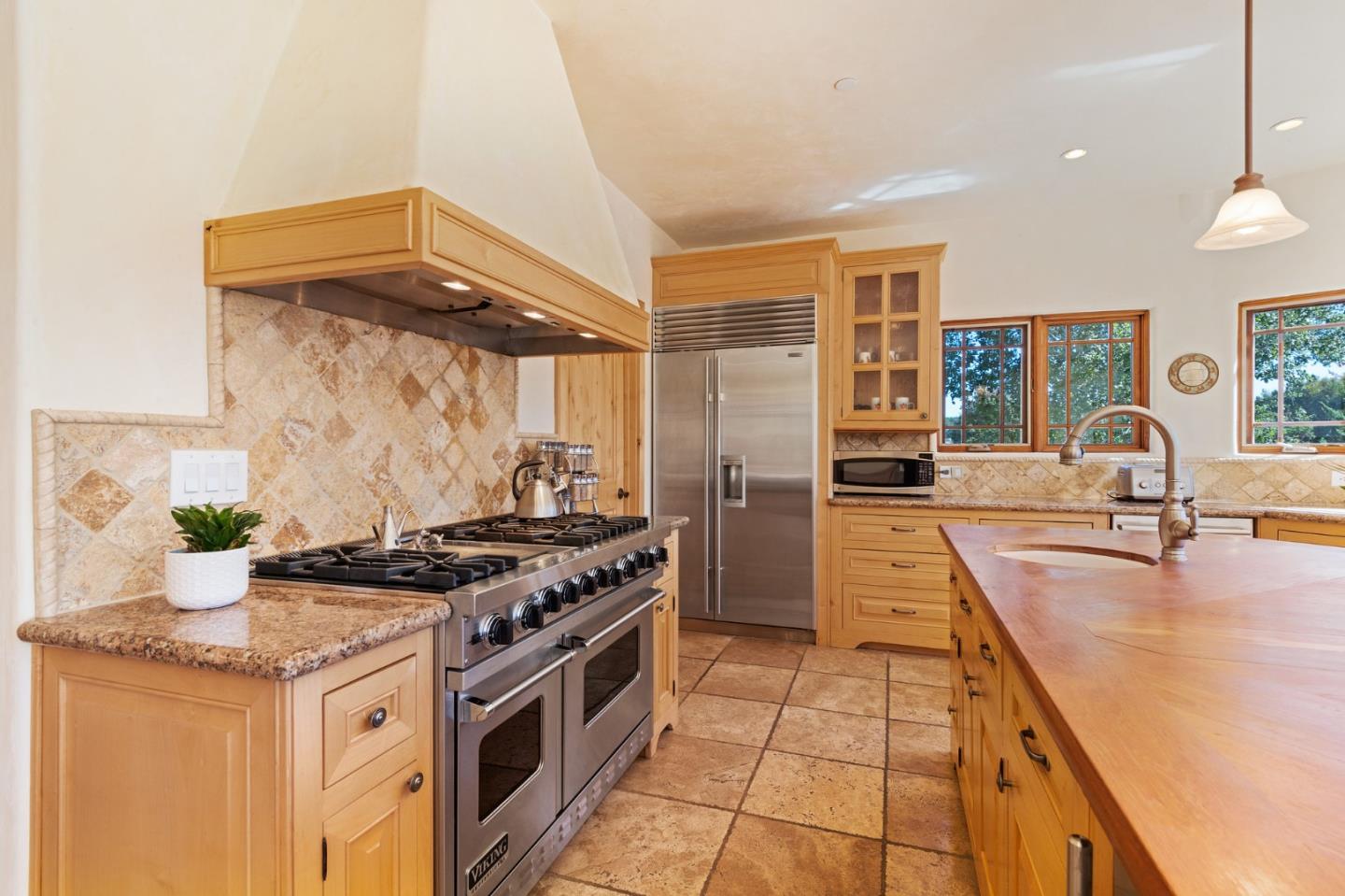 175 Chaparral Road Carmel Valley, CA 93924 - Photo 19 of 66 a kitchen with stainless steel appliances granite countertop a stove and a refrigerator