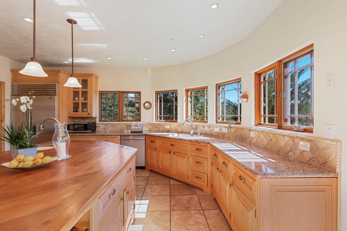 175 Chaparral Road Carmel Valley, CA 93924 - Photo 21 of 66 a kitchen with stainless steel appliances granite countertop a stove a sink and a wooden floors
