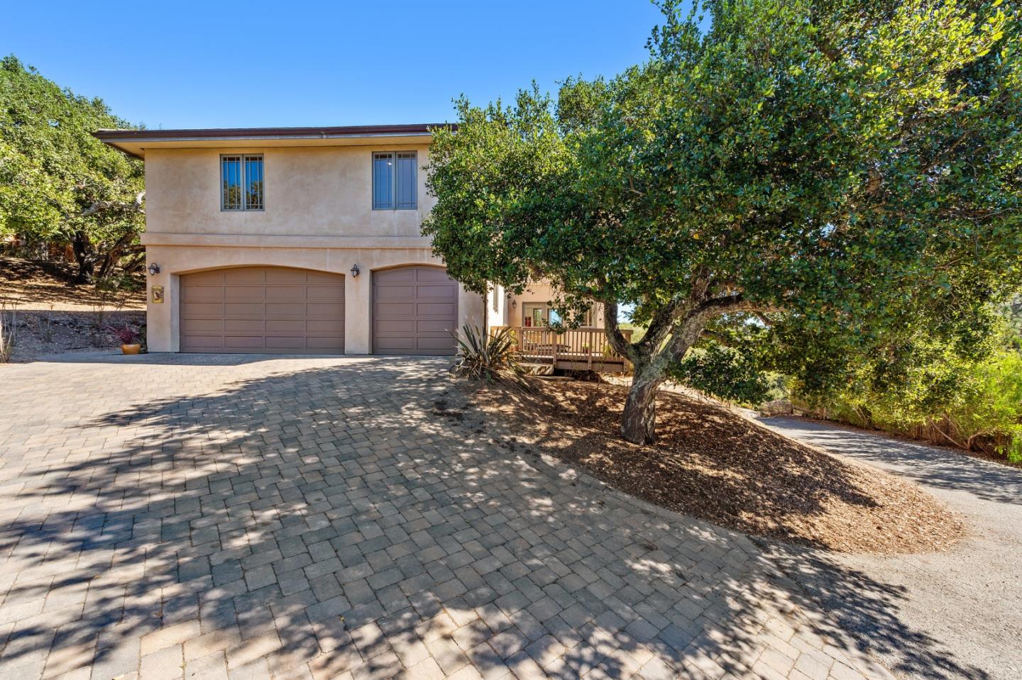 175 Chaparral Road Carmel Valley, CA 93924 - Photo 60 of 66 a front view of a house with a tree