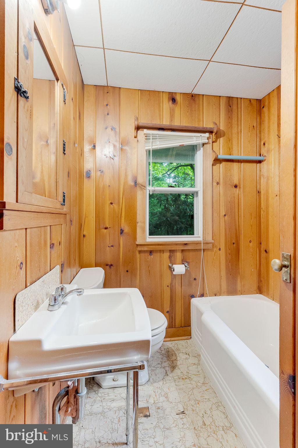 2138 Cedar Road Port Republic, MD 20676 - Photo 16 of 34 a bathroom with a sink and a bathtub