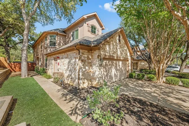 a view of a street with a building in the background