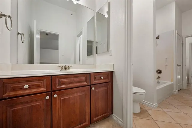 a bathroom with a sink a toilet and bathtub