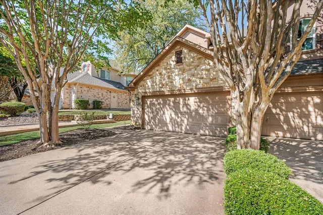a view of backyard with large trees