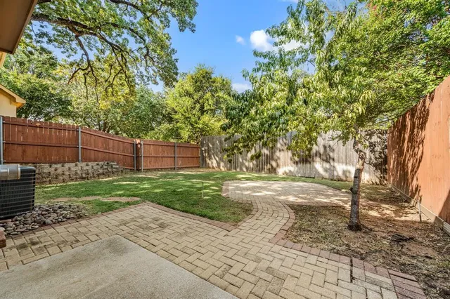 a view of backyard with green space