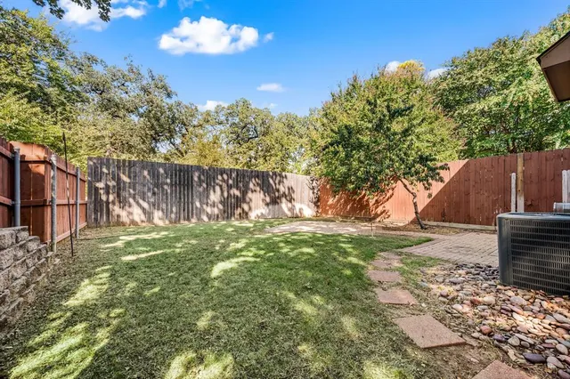 a view of a backyard with tree s