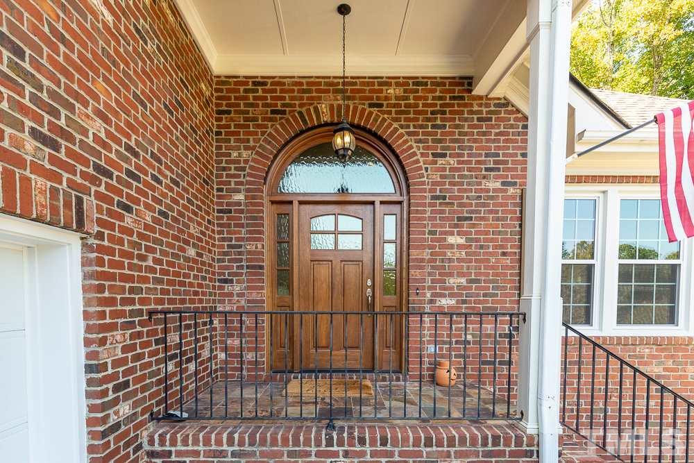 5021 Martin Farm Road Raleigh, NC 27613 - Photo 2 of 30 a view of a wooden door
