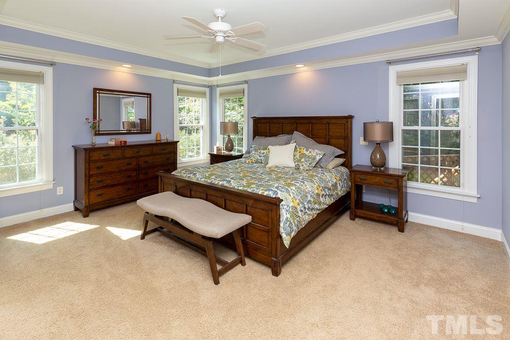 5021 Martin Farm Road Raleigh, NC 27613 - Photo 12 of 30 a bedroom with a bed and a dresser