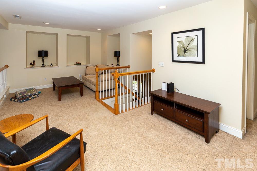 5021 Martin Farm Road Raleigh, NC 27613 - Photo 21 of 30 a living room with furniture and a window