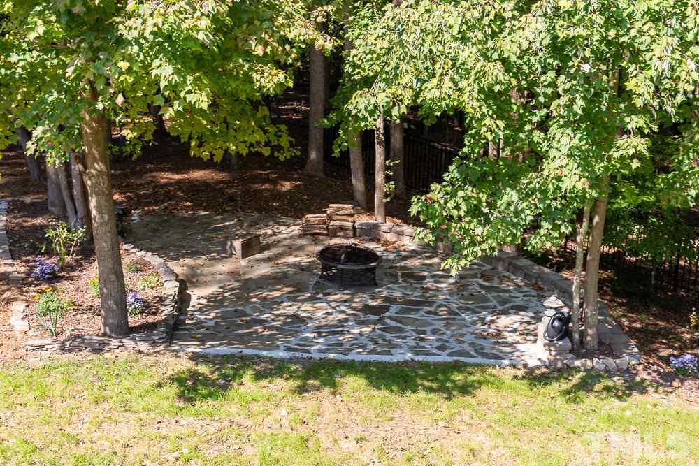 5021 Martin Farm Road Raleigh, NC 27613 - Photo 25 of 30 a view of a lake with a tree