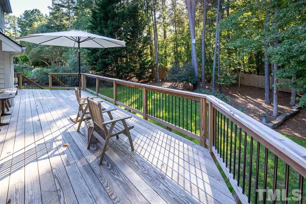 5021 Martin Farm Road Raleigh, NC 27613 - Photo 26 of 30 a view of a wooden deck with furniture