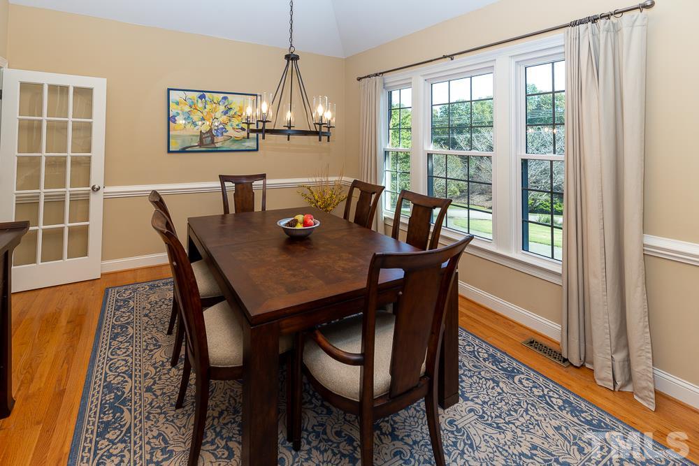 5021 Martin Farm Road Raleigh, NC 27613 - Photo 4 of 30 a view of a dining room with furniture window and wooden floor