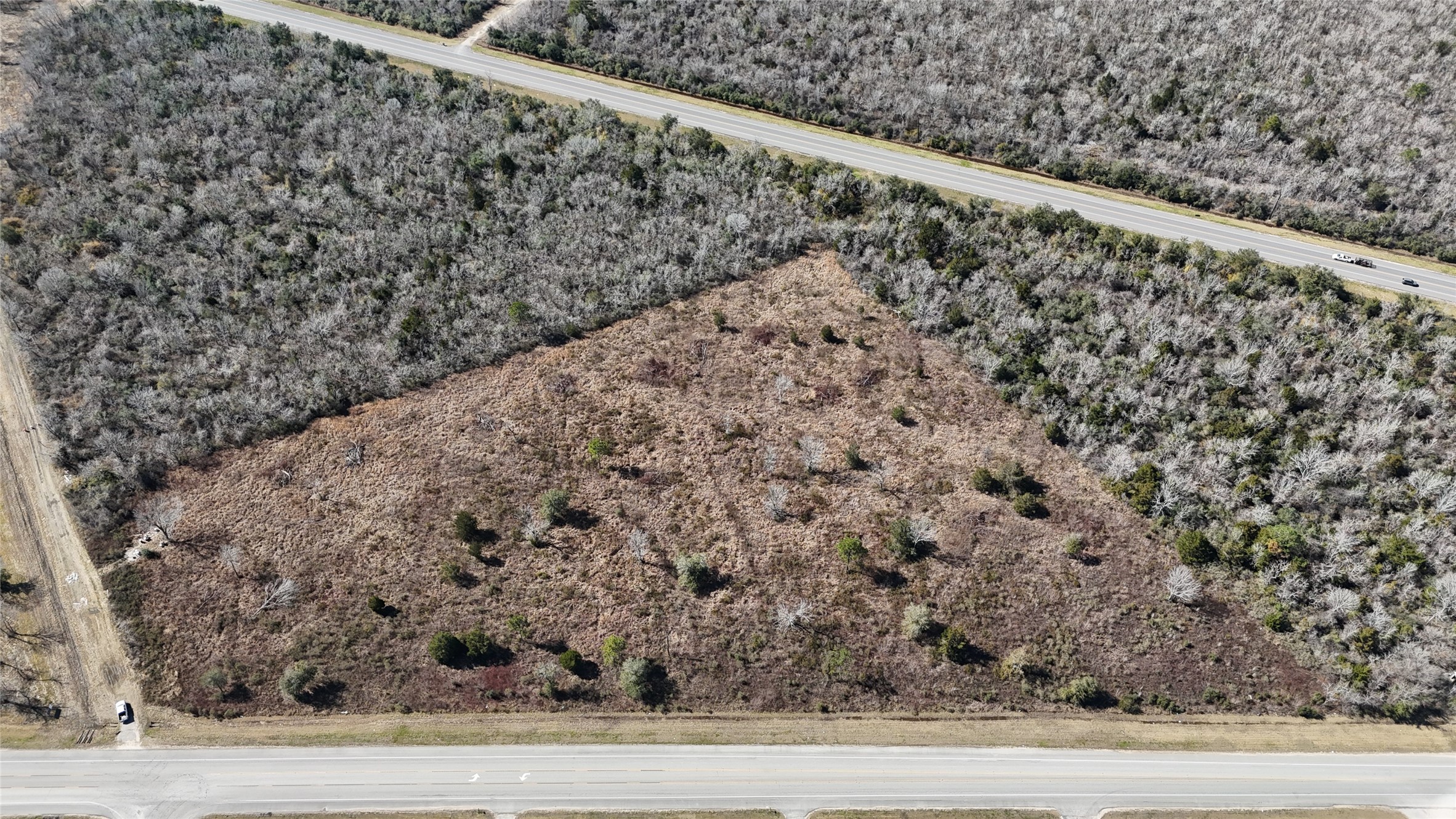0 Fm 2403 Alvin, TX 77511 - Photo 6 of 7 a view of a large yard with a wooden fence