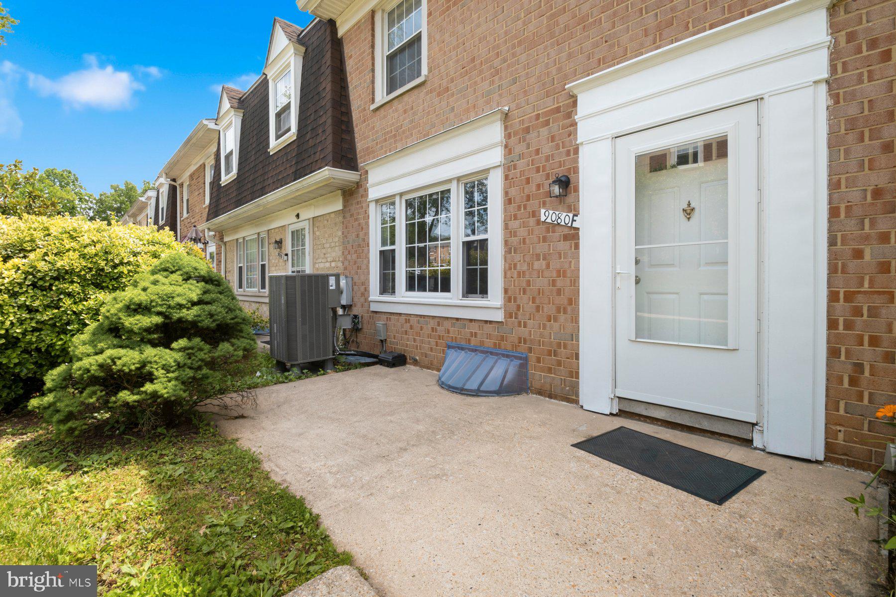 9080 Moonshine Hollow, Unit F Laurel, MD 20723 - Photo 3 of 24 Charming entryway with lush greenery.