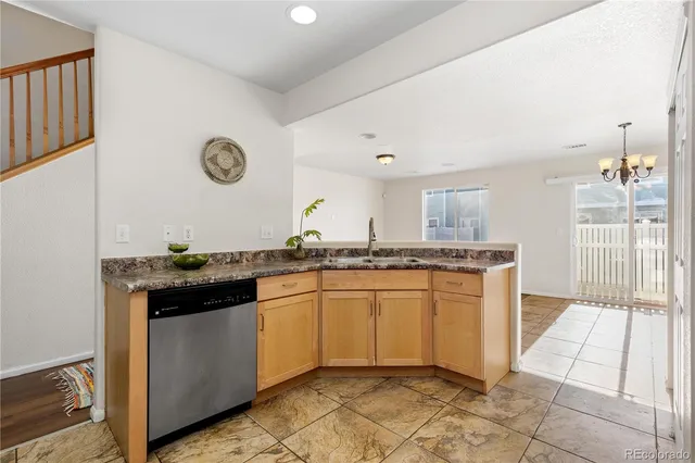 a kitchen with stainless steel appliances granite countertop a stove and a sink