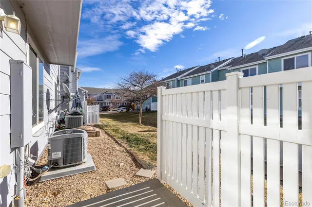 a view of a balcony with chair and front door