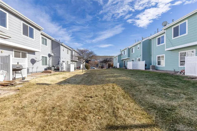 a view of multiple houses with a street