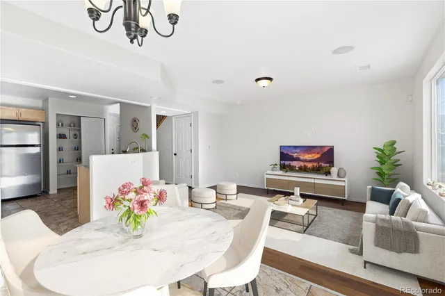 a living room with furniture and flat screen tv