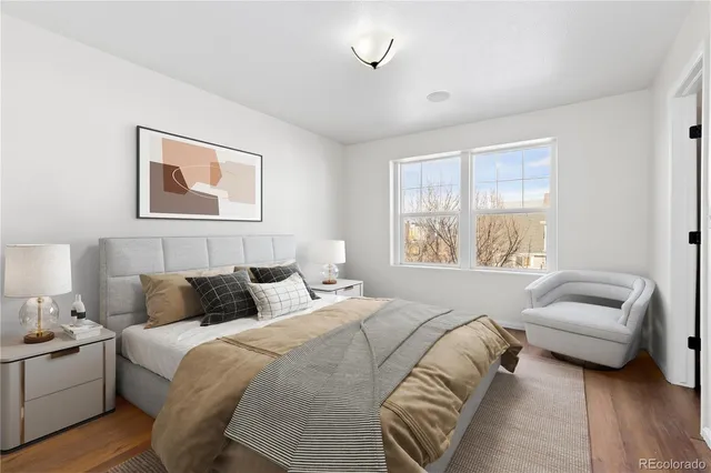 a bedroom with bed and a couch