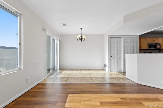 a view of a livingroom with wooden floor