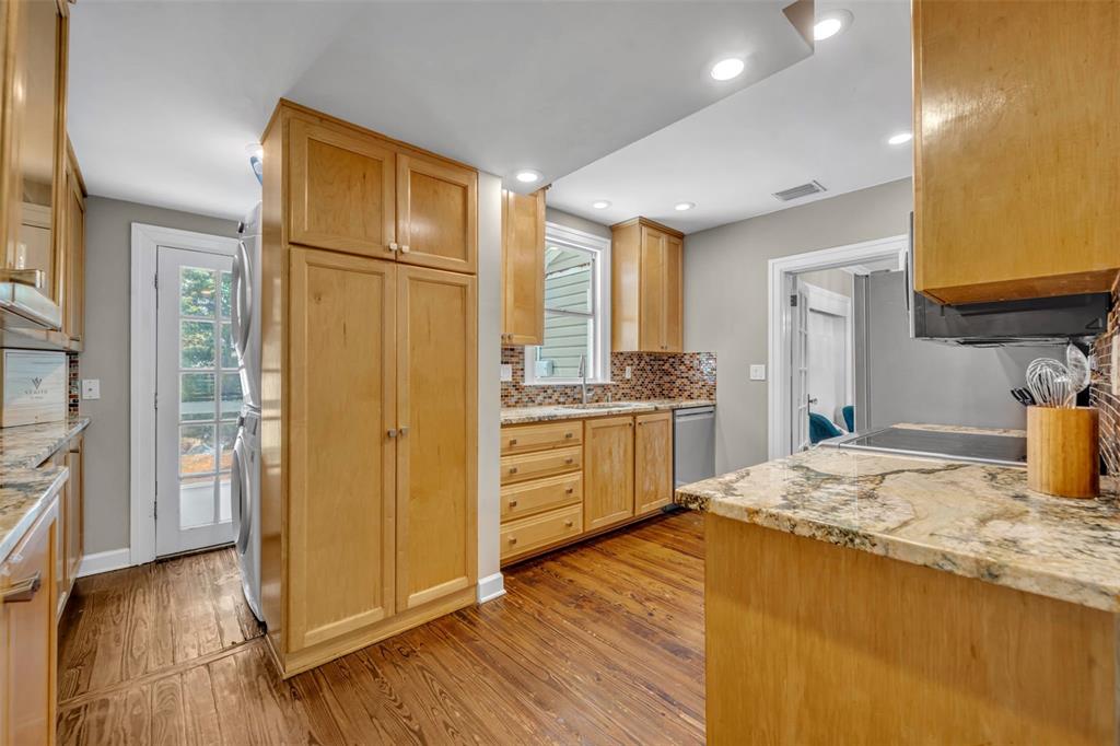 1960 Winter Park Road Winter Park, FL 32789 - Photo 17 of 46 a kitchen with a refrigerator sink and cabinets