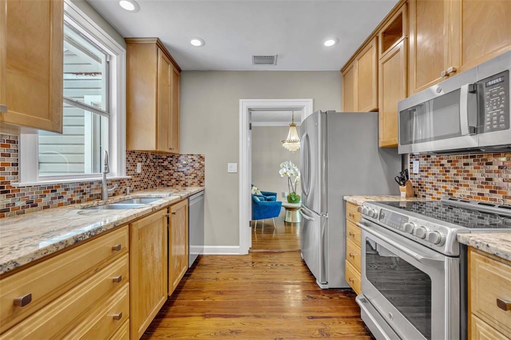 1960 Winter Park Road Winter Park, FL 32789 - Photo 18 of 46 a kitchen with granite countertop a sink stove and cabinets