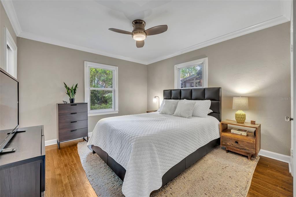 1960 Winter Park Road Winter Park, FL 32789 - Photo 23 of 46 a bedroom with a large bed and a chandelier