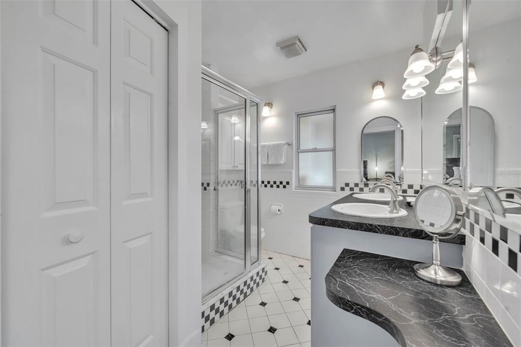 1960 Winter Park Road Winter Park, FL 32789 - Photo 25 of 46 a bathroom with a sink double vanity and a mirror