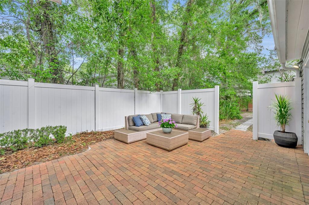1960 Winter Park Road Winter Park, FL 32789 - Photo 30 of 46 a view of a patio with couches and table and chairs with wooden floor and plants