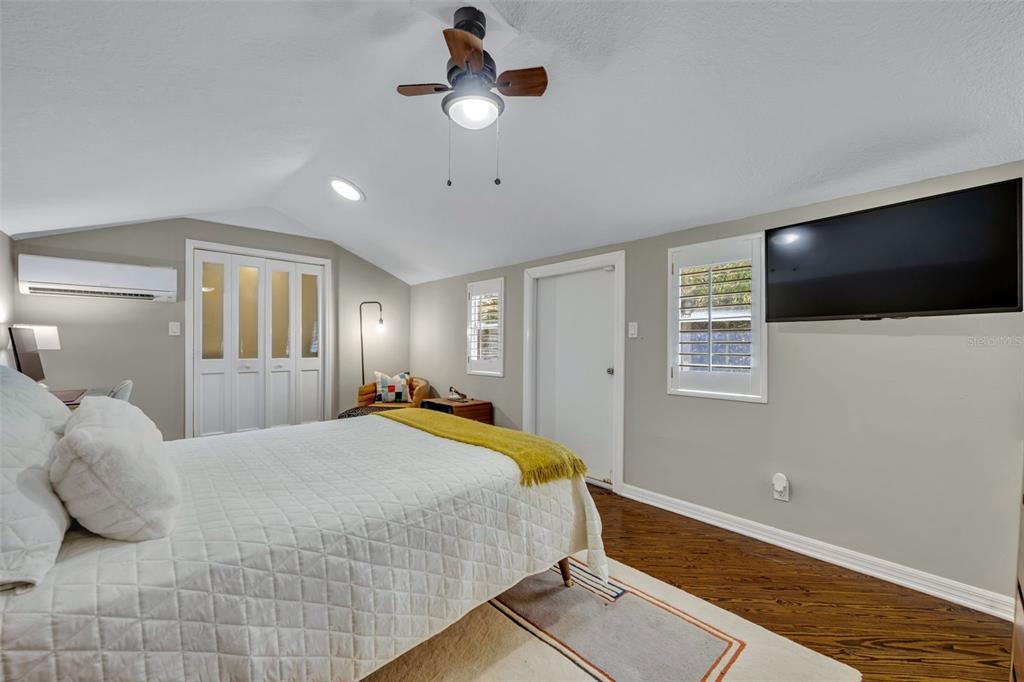 1960 Winter Park Road Winter Park, FL 32789 - Photo 38 of 46 a bedroom with a bed and a flat screen tv